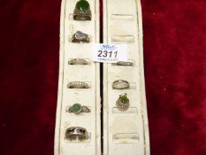 A quantity of silver and other metal rings including; buckle design, set with polished stones, etc.