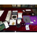 A quantity of costume jewellery including chains, rings, compact etc.