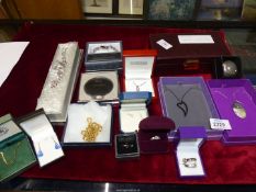 A quantity of costume jewellery including chains, rings, compact etc.