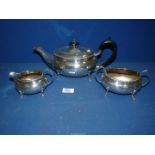 An Epns Teaset including teapot with Bakelite finial and handle, milk jug and sugar bowl.