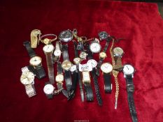 A Longines gents watch together with a large quantity of gents and ladies watches.