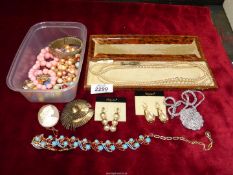 A quantity of costume jewellery including cameo brooch, sterling silver brooch, earrings, chains,