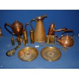 A quantity of brass to include; a chocolate pot kettle, empty shell cases, jug, plates, etc.