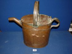 A copper watering can.