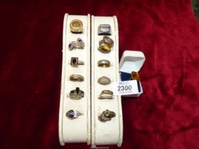 A quantity of gents and ladies rings, some sterling and including one gold coloured coin ring.
