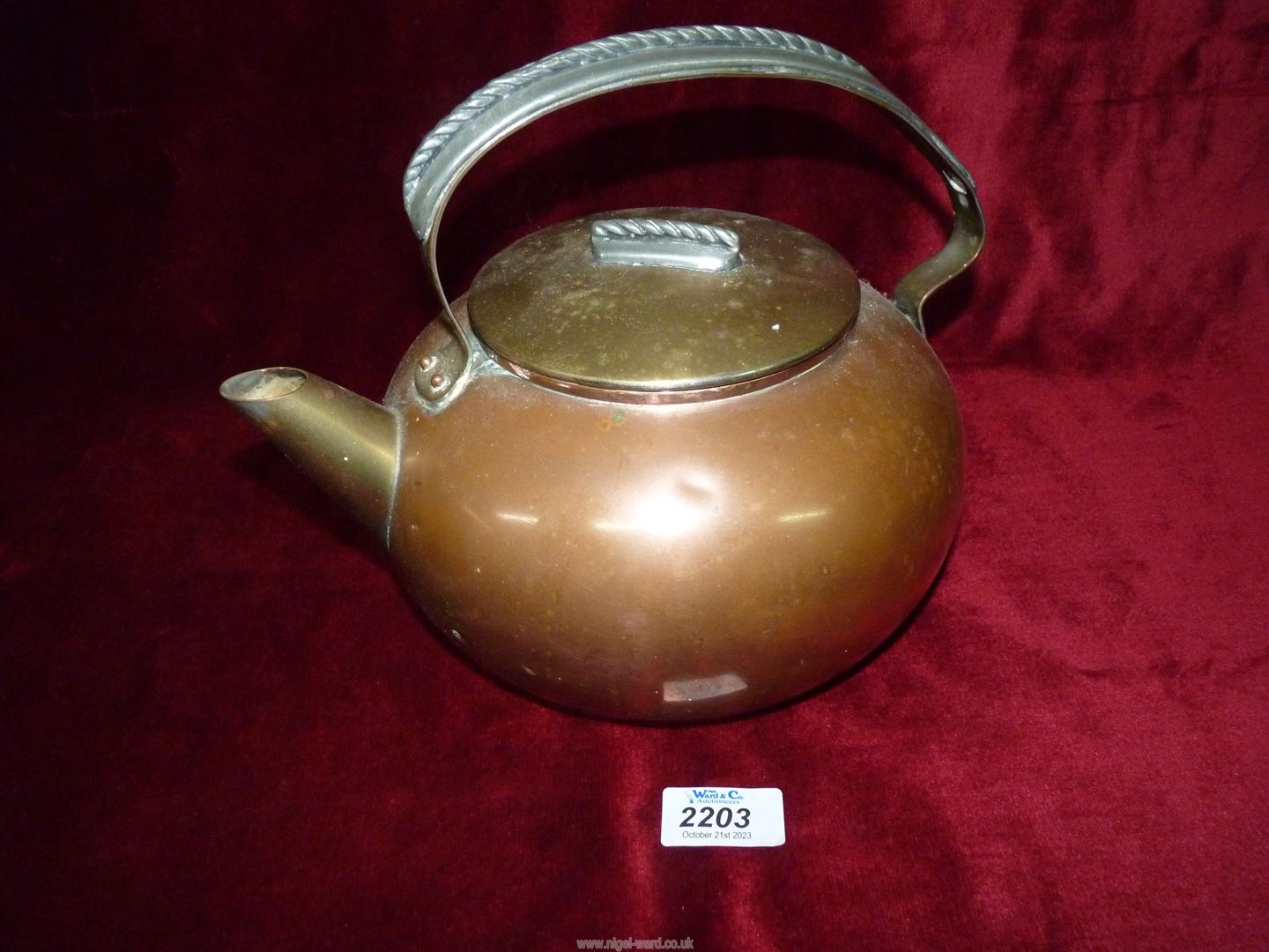 A Copper and brass kettle.