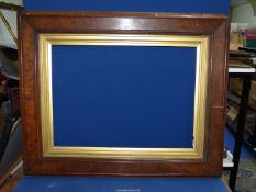 A large heavy wooden frame with gilded insert and chain, overall, 3' 4" x 2' 8",