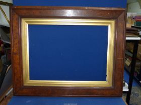 A large heavy wooden frame with gilded insert and chain, overall, 3' 4" x 2' 8",