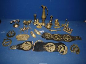 An old "Black Magic" tin of brass ornaments, martingales, etc.