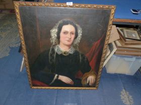 A mid 19th century Victorian Oil painting of a sitting matron with lace hat and cuffs.