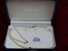 A 9ct gold clasp pearl necklace, bracelet and earring set in Crouch Goldsmith box.