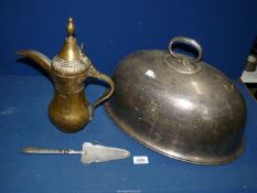 A large plated Meat cover, brass Arabic coffee pot and metal cake slice.