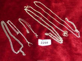 Six chains, with wishbone and cross pendants, one silver chain a/f.