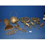 A quantity of brass to include a kettle, four deer, two trivets etc.