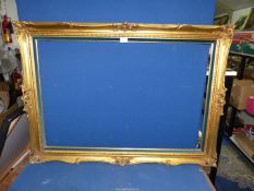 A modern gilt picture frame with added velvet teal inset. 42 1/2" x 30 1/2" overall size.