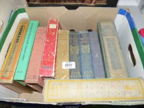 A box of books to include Sahara by Georg Gerster, Tales of Narnia by C.S.