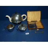 An insulated teapot, sugar bowl and jug, cased set of butter knives, etc.