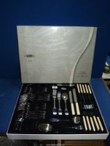 A boxed Stellar forty four piece cutlery set.