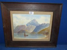 A framed and mounted watercolour of a mountainous lake scene with sailing boat in the foreground,