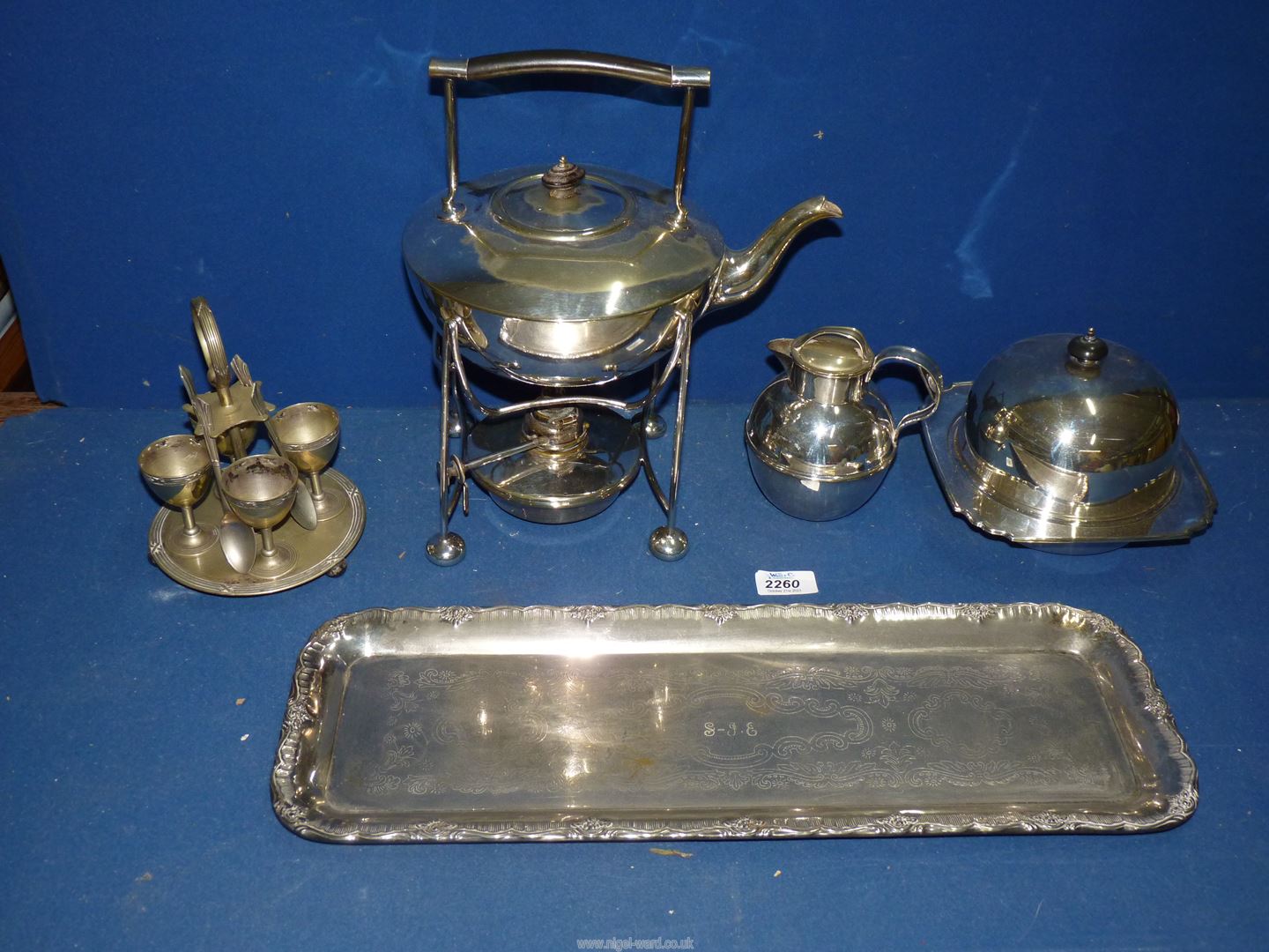 Miscellaneous silver plate items including muffin dish, kettle on stand, egg cup set, etc.