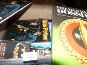 A quantity of Blue Peter Annuals, The Dan Dare Dossier, Spike Milligan, etc.