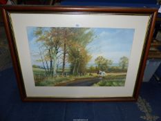 A large framed and mounted print of a country landscape with a team of horses with the framed at