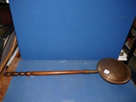 A copper bed warming pan, 41" long overall.