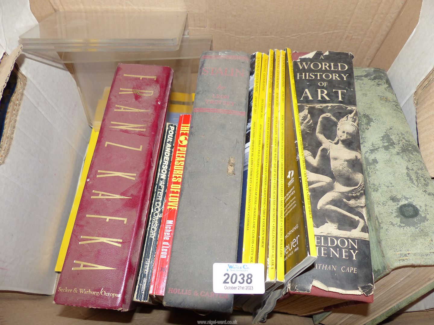 A box of books to include Stalin by Leon Tolstoy, Geographical magazines, Medical Diagnosis, etc.