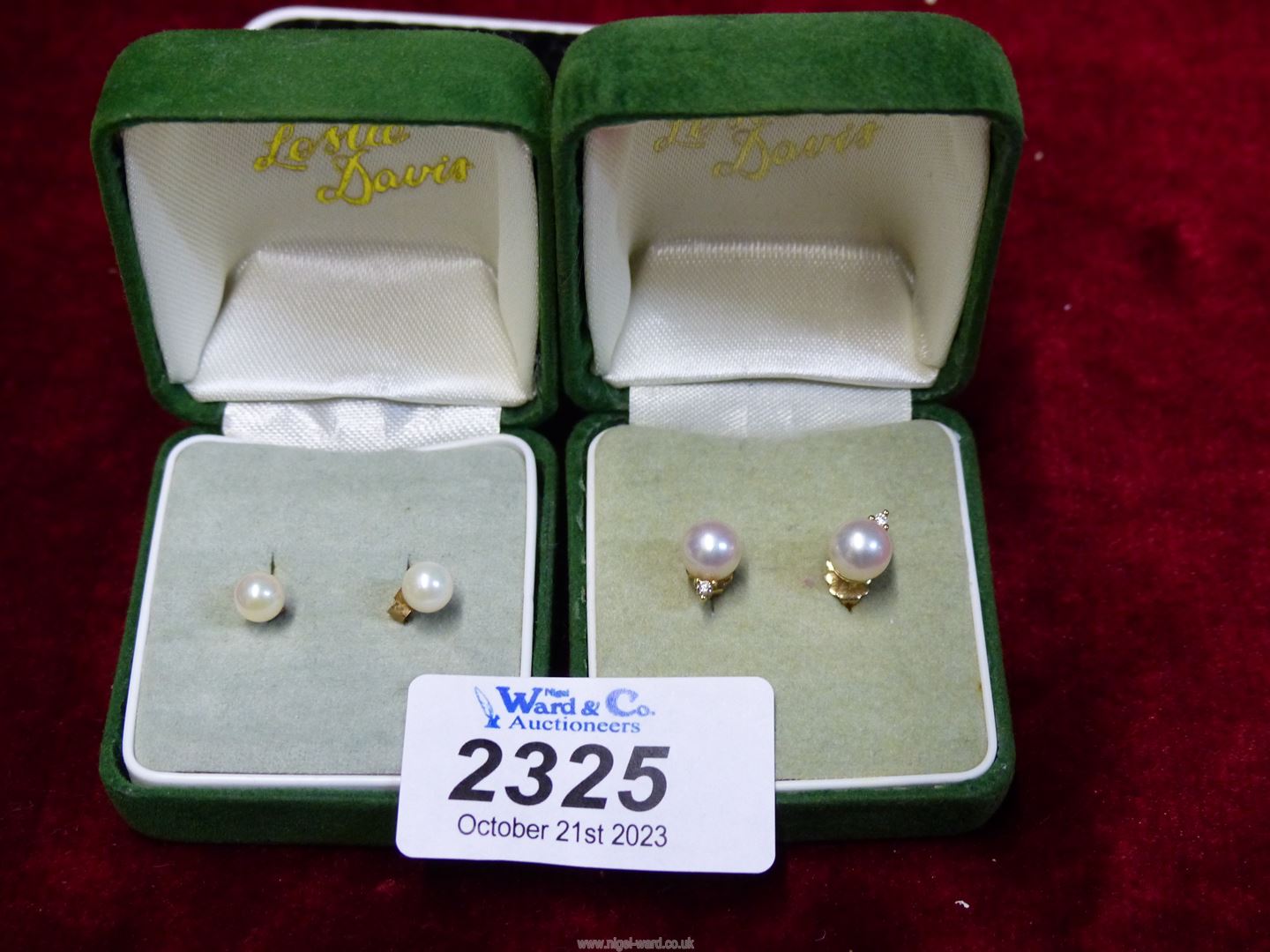 A pair of pearl studs with 9ct back and pair of 9ct gold pearl studs with diamond chips.