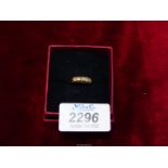 An 18ct gold Engagement ring set with five diamonds, London. Size M.