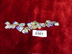 A vintage silver souvenir Shield charm Bracelet (twenty-five charms), most charms stamped 'silver',
