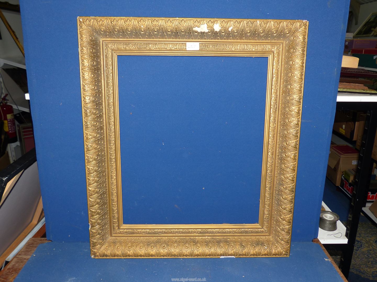 A large heavy ornate gilt frame, overall 2' 6" x 2' 2", aperture 1' 10 1/2" x 1' 6 1/2",