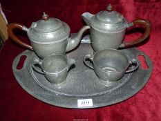 A Warstone Pewter hammered / beaten effect four piece Teaset with tray (teapot finial loose).