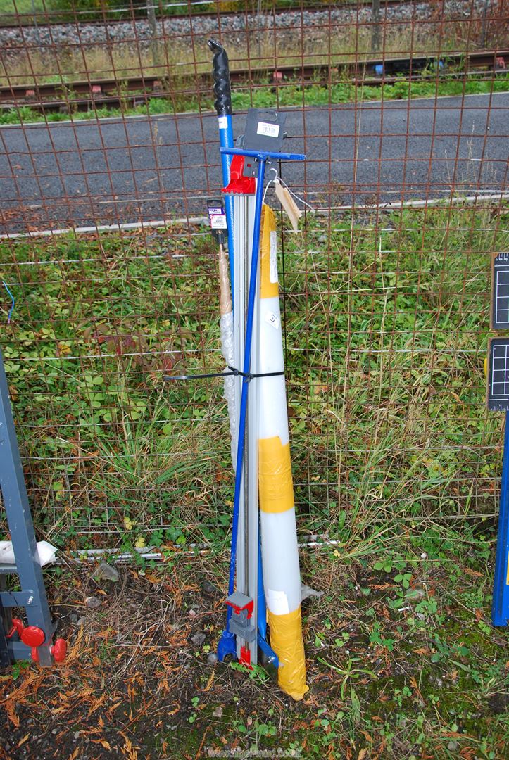 Long arm stop cock lever bar, a long masonry bit, wallpaper stripper, and a roll of polythene.