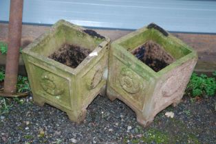 Two Concrete planters (one foot missing on each) -14" high.