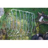 A galvanised wall mounted hay rack.