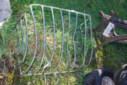 A galvanised wall mounted hay rack.