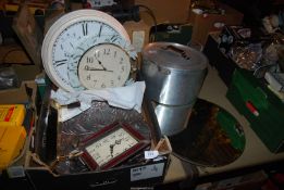 A bevel plated mirror, three clocks, glass dish and a large galvanised saucepan.