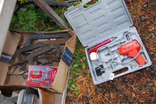 A soldering gun and a quantity of G clamps.