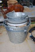 A quantity of galvanised and enamel buckets.