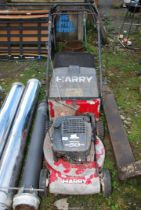 A 'Harry' self-propelled lawn mower with grass box (working at time of lotting).