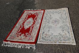 Two rugs - a red rug - 5' x 30", and one made in India 5' x 30½".