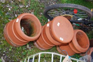 Three terracotta chimney pots.