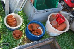 A large quantity of glazed and clay pots.