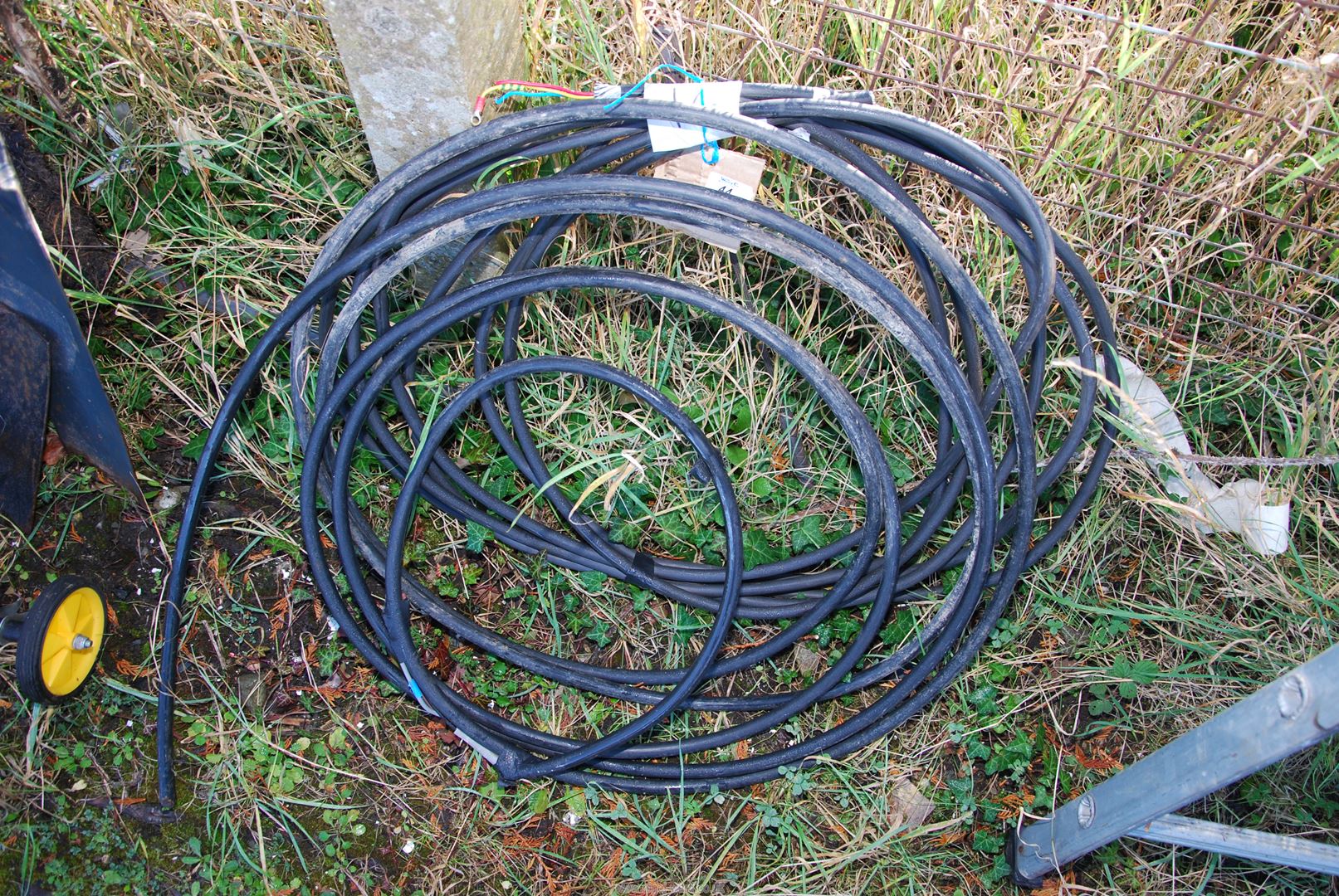 Two rolls of armoured cable.