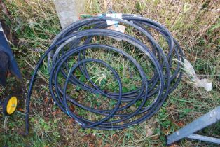 Two rolls of armoured cable.