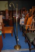 A floor standing brass lamp - 58½" high.