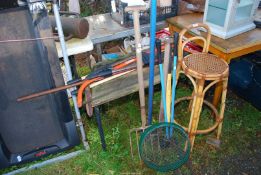 A large quantity of garden tools, post rammer and bamboo high, stool, and forks etc.