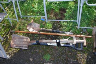 A quantity of mixed garden tools - rake, spades, and fork etc.