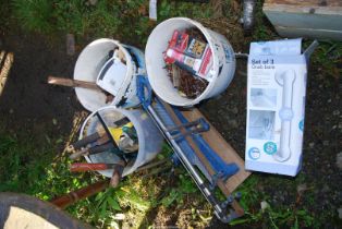 Bucket of nails, mitre saw, grab bars and a bucket of tools.